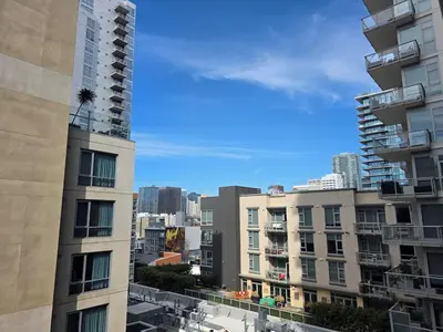 a view of a city with tall buildings at Downtown Beautiful 3-bedroom Apartment Steps to Convention Center, Petco Park! in San Diego