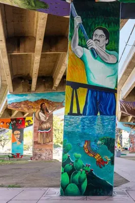 a column with paintings on the side of a building at Barrio Bungalow by Coastline Vacation Rentals in San Diego
