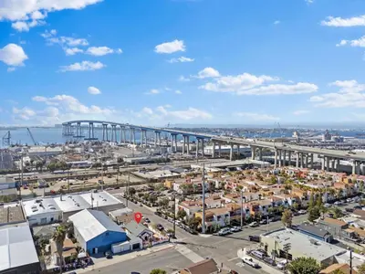 an aerial view of a city with a bridge in the background at Barrio Bungalow by Coastline Vacation Rentals in San Diego