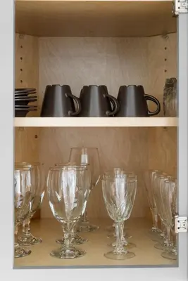 a bunch of wine glasses on a shelf at Barrio Bungalow by Coastline Vacation Rentals in San Diego