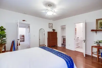 a white bedroom with a bed and a dresser at Casa Mellifora 3BR Golden Hill w Garage Parking in San Diego