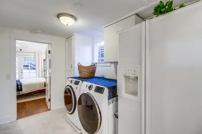 a white laundry room with a washer and dryer at Casa Mellifora 3BR Golden Hill w Garage Parking in San Diego