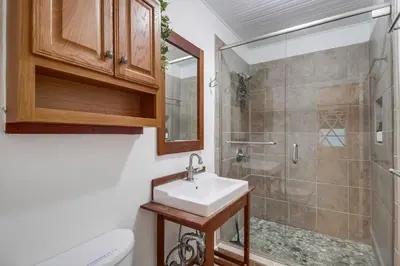 a bathroom with a sink and a shower at Casa Mellifora 3BR Golden Hill w Garage Parking in San Diego