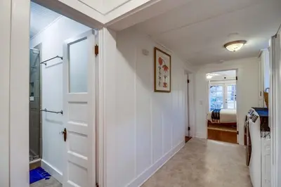a hallway with a door leading to a bedroom at Casa Mellifora 3BR Golden Hill w Garage Parking in San Diego
