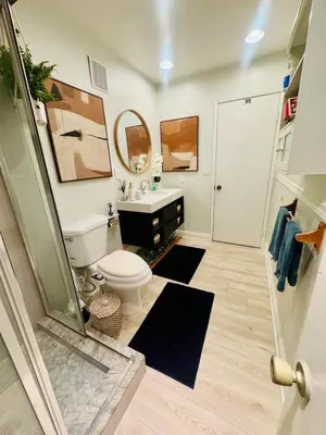 a bathroom with a toilet and a sink and a shower at My Cozy Place in Mission Viejo