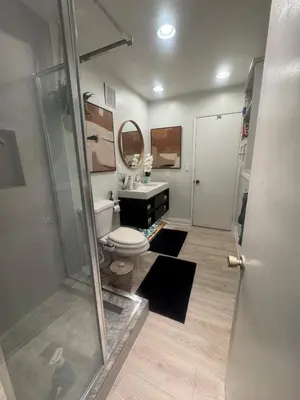 a bathroom with a shower and a toilet and a sink at My Cozy Place in Mission Viejo