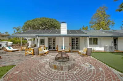 a patio with a fire pit in front of a house at O-side Oasis in Oceanside