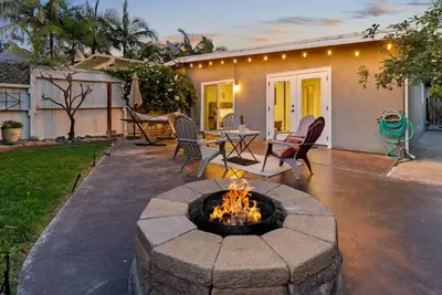 a patio with a fire pit in the yard at Serena Encinitas by Coastline Vacation Rentals in Encinitas