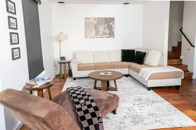 a living room with a couch and a table at Chic SD Basecamp - Walk to Downtown in San Diego