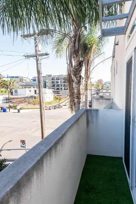 a retaining wall with green grass on the side of a building at Chic SD Basecamp - Walk to Downtown in San Diego