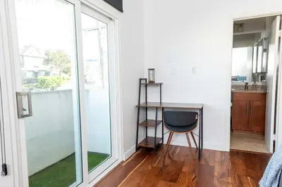 a small desk in a room with a window at Chic SD Basecamp - Walk to Downtown in San Diego