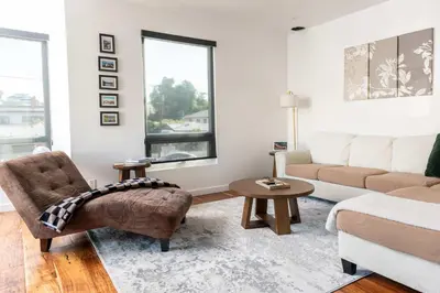 a living room with a couch and a table at Chic Downtown SD Hub for Families & Friends in San Diego
