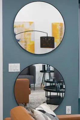 a mirror on a wall in a living room at Modern Design Temecula House-30 in Temecula