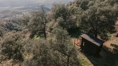 an overhead view of a cabin on a hill with trees at Tiny Home Above the Clouds Pacific Views in Pauma Valley