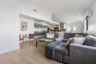 a living room with a couch and a table at Family Pool House Oasis in National City