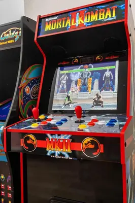 a video game machine with a spider man game at Family Pool House Oasis in National City