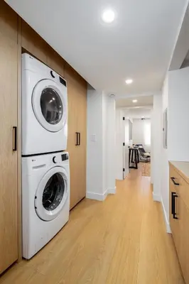 a laundry room with a washer and dryer at Marina Dream - Lagoon Views in Carlsbad