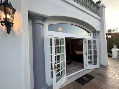 an entry to a house with an open door at San Diego French Garden Poolside Retreat - Wine Country & Safari Park in Escondido