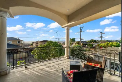 a balcony with a view of a city at Tuscan Sands by Coastline Vacation Rentals in San Diego