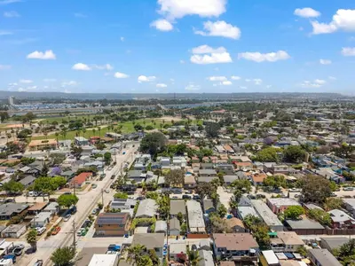 an aerial view of a town with houses and a street at Lotus House by Coastline Vacation Rentals in San Diego