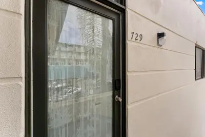 a door with a window with the on it at The Surf Shack by Coastline Vacation Rentals in San Diego