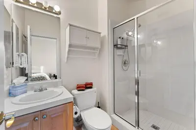a bathroom with a shower and a toilet and a sink at Carmel Valley Villa by Coastline Vacation Rentals in San Diego