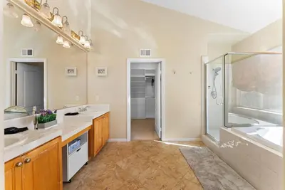 a large bathroom with two sinks and a shower at Carmel Valley Villa by Coastline Vacation Rentals in San Diego