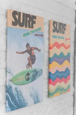 two magazines with a man riding a wave on a surfboard at The Wave by Coastline Vacation Rentals in San Diego
