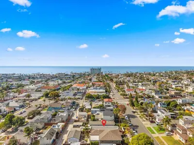 an aerial view of a city with houses and the ocean at The Wave by Coastline Vacation Rentals in San Diego
