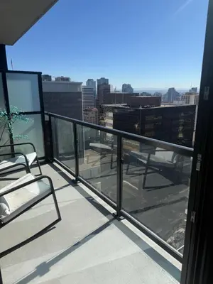 a balcony with chairs and a view of a city at Little Italy, close to everything in San Diego