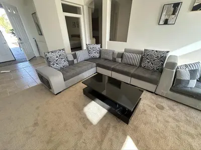 a living room with a couch and a coffee table at Beautiful Villa with Amazing 360 Mountain Views, Golfcourses close to Monserate Winery and I-15 in Fallbrook