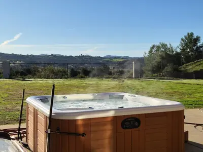 a jacuzzi tub sitting in a yard at Beautiful Villa with Amazing 360 Mountain Views, Golfcourses close to Monserate Winery and I-15 in Fallbrook