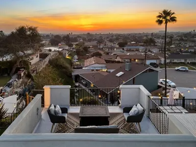 a view of a city from the balcony of a house at The Lookout by Coastline Vacation Rentals in Chula Vista