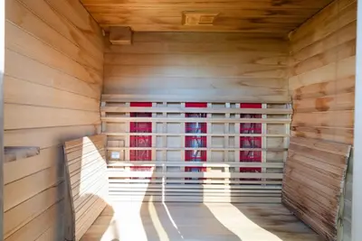 a sauna with wooden walls and a window at The Lookout by Coastline Vacation Rentals in Chula Vista