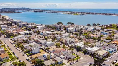 an aerial view of a city and the ocean at The Point by Coastline Vacation Rentals in San Diego