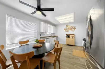 a kitchen and dining room with a table and chairs at Athena FULL Property in Encinitas