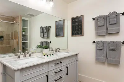 a bathroom with a sink and a mirror at SD Modern Rustic 3BR Apartment in San Diego
