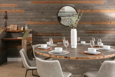 a dining room with a table with chairs and a mirror at SD Modern Rustic 3BR Apartment in San Diego