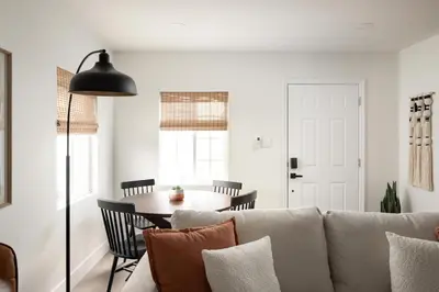 a living room with a couch and a table at The Outpost by Coastline Vacation Rentals in San Diego