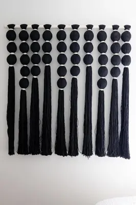 a row of black ties on a wall at The Outpost by Coastline Vacation Rentals in San Diego