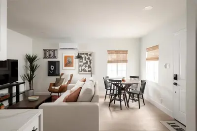 a living room with a couch and a table at The Outpost by Coastline Vacation Rentals in San Diego