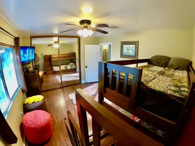 a room with a bedroom with a bed and a couch at Villa La Cresta - 5 Acre Retreat in Murrieta