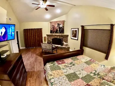 a bedroom with a bed and a flat screen tv at Villa La Cresta - 5 Acre Retreat in Murrieta