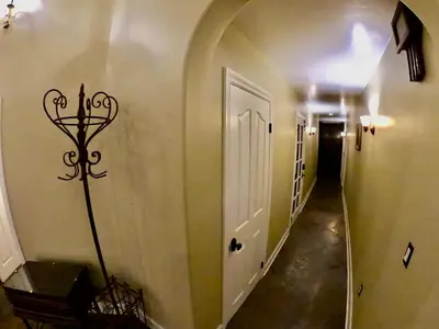 a hallway with a white door and a hall way at Villa La Cresta - 5 Acre Retreat in Murrieta