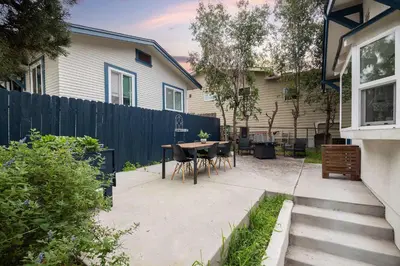 a backyard with a table and chairs and a fence at Close to Balboa Park Central Villa in San Diego