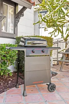 a grill sitting on a table in front of a house at The Ruby Door by Coastline Vacation Rentals in San Diego