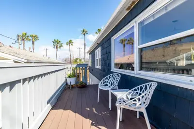 two chairs sitting on the porch of a house at Ocean Beach Bungalow - Close To Beach in San Diego