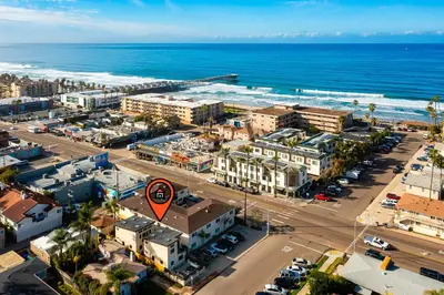 an aerial view of a city with the ocean at PB New Build - Steps to Sand & Surf in San Diego
