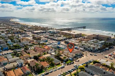 an aerial view of a city and the ocean at PB New Build - Steps to Sand & Surf in San Diego