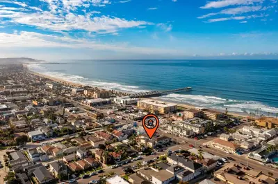 an aerial view of a city and the ocean at PB NEW BUILD l A Block from SAND in San Diego